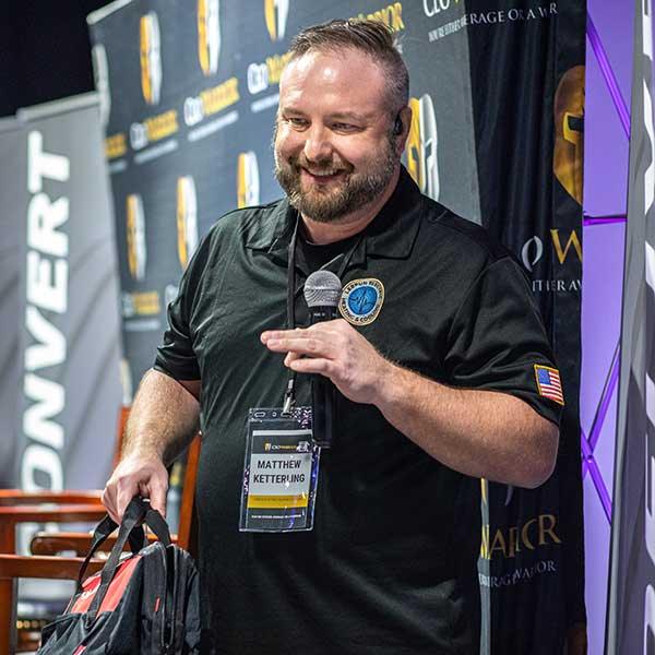 A CEO Warrior member speaking at a live training event