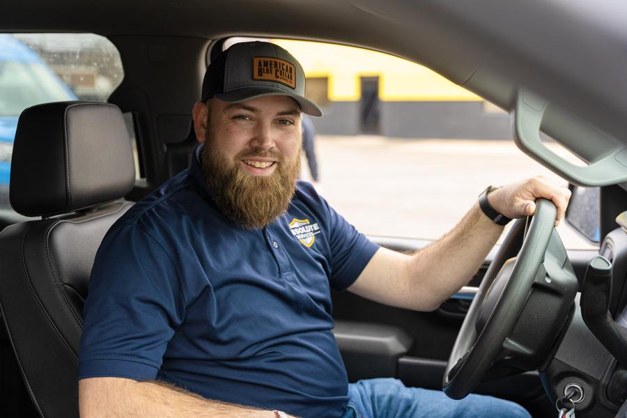An Absolute Services technician in his truck